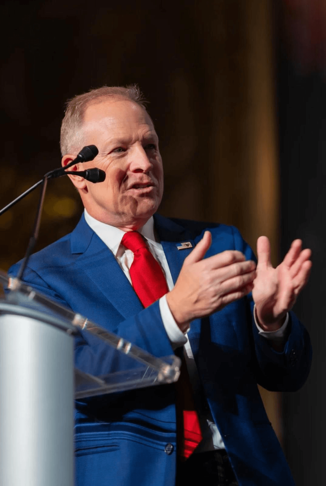 Kent Emmons gesturing mid-talk at Trump’s Mar-a-Lago