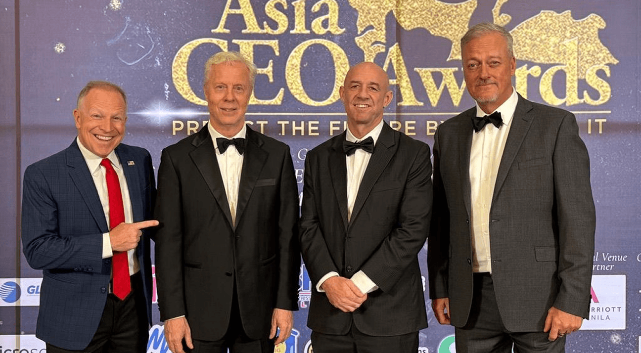Kent Emmons with three guests on the Asia CEO Awards red carpet